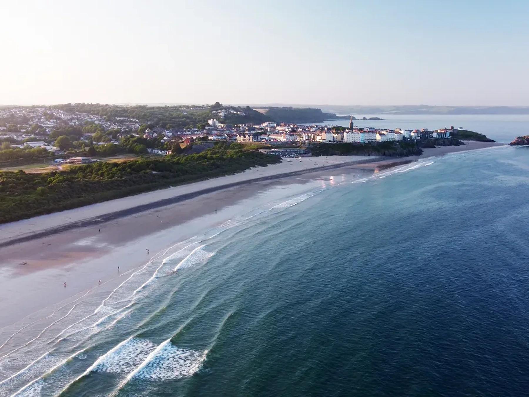 Tenby South Beach, with the town and wide sand visible from above