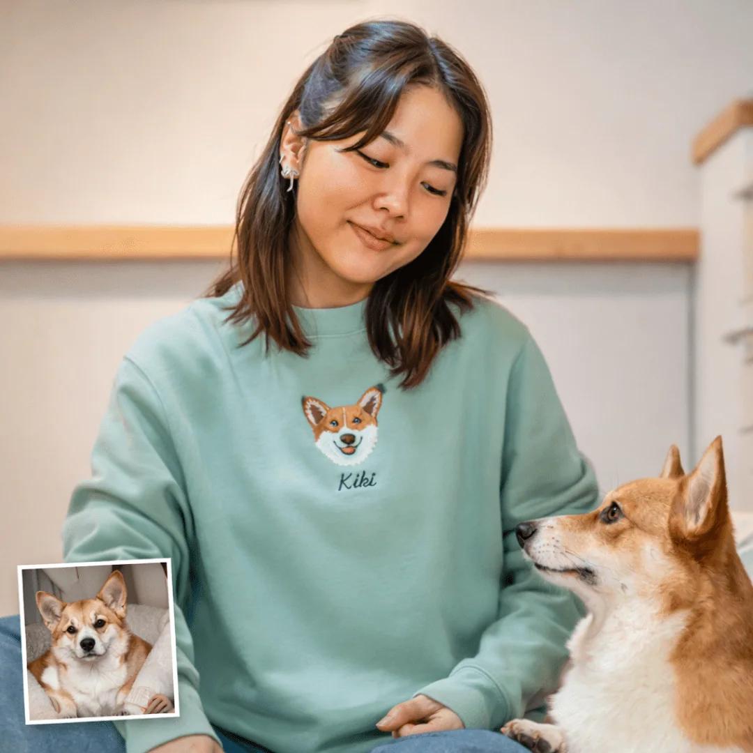 An embroidered sweatshirt featuring a pet portrait