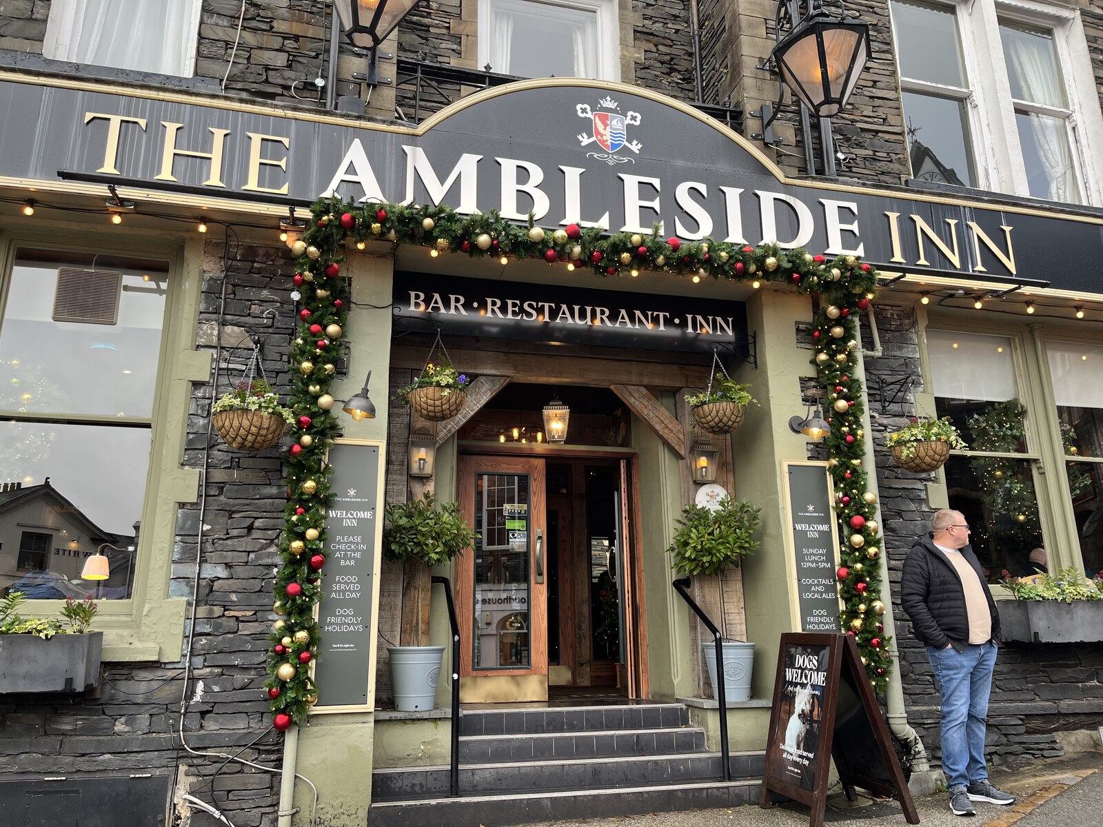 The stone frontage and entrance of The Ambleside Inn