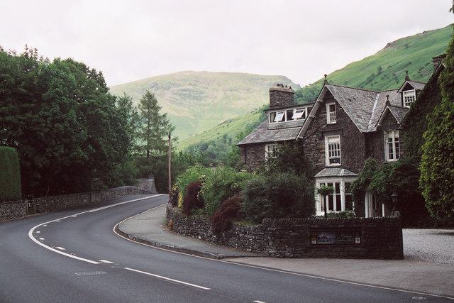 Rothay Garden hotel in Grasmere with green fells behind it