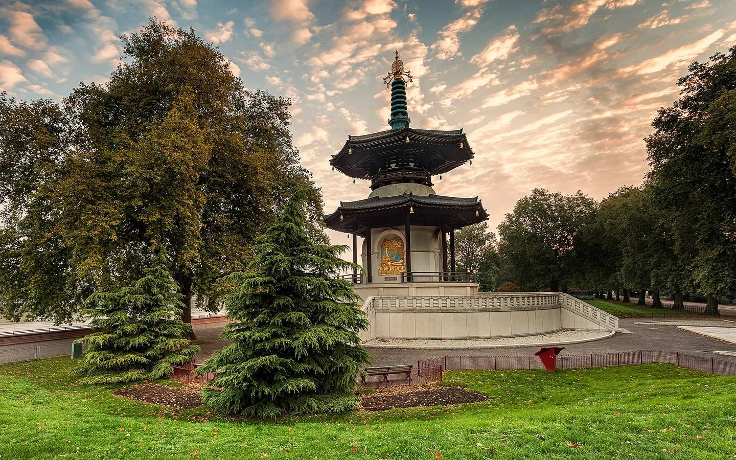 Peace Pagoda framed by trees in Battersea Park at sunrise