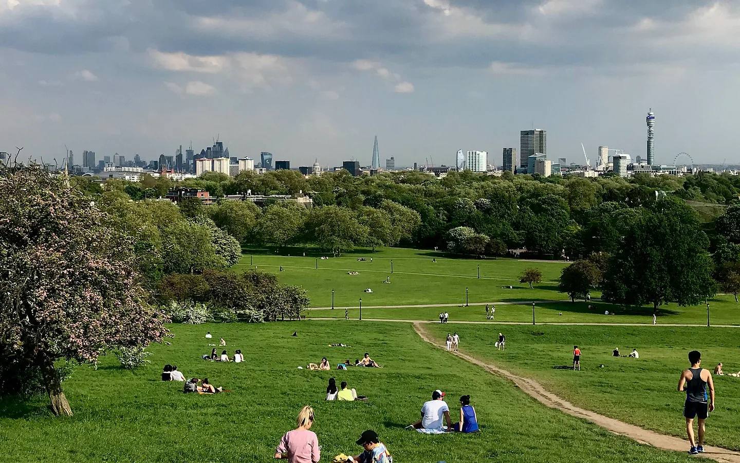 London skyline across the green slopes of Primrose Hill