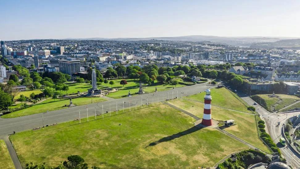 Aerial view across Plymouth Hoe with Smeaton’s Tower and the city beyond