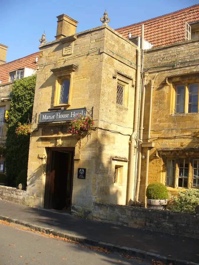 The stone entrance of The Manor House Hotel in Moreton-in-Marsh