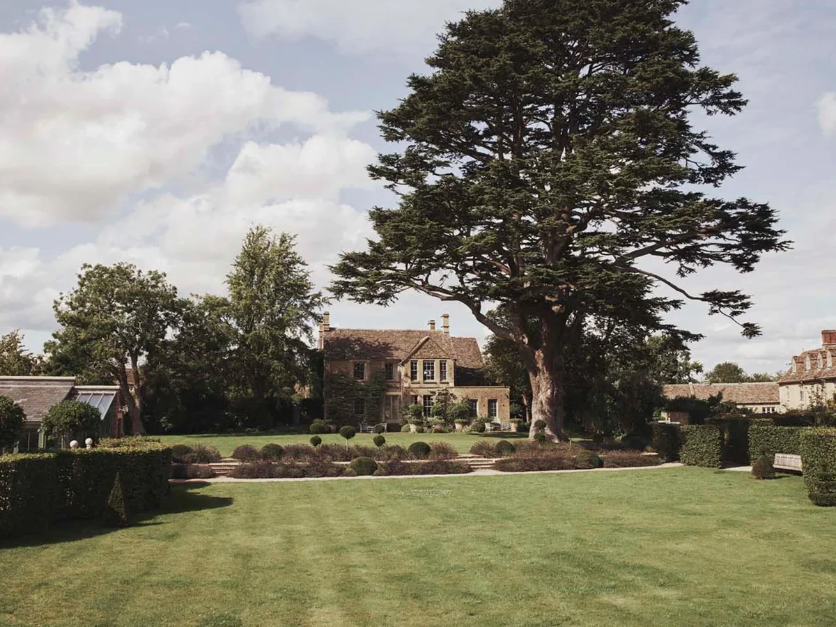 The Lodge, gardens and cedar tree at Thyme in Southrop