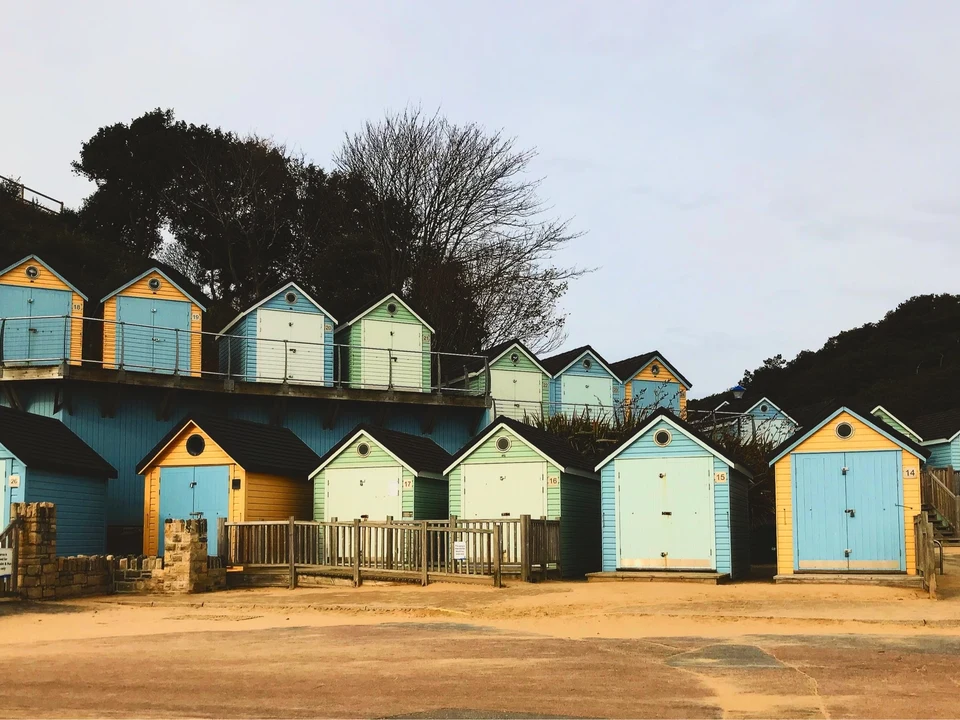 Colourful beach huts at Alum Chine, an overview of the arrival area