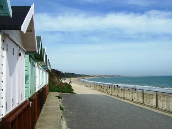 Friars Cliff promenade and beach huts, not a marker of the wave-wall dog zone