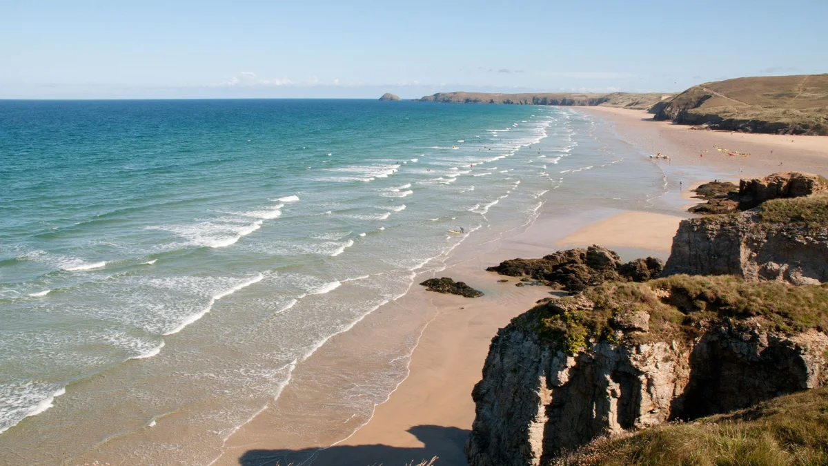 Wide sandy Perranporth Beach beneath the Cornish coast.