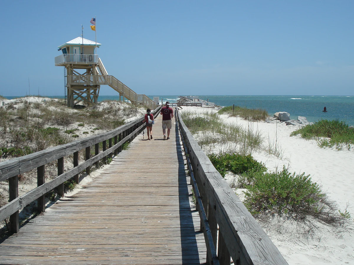 A boardwalk crosses the dunes toward the coast at Lighthouse Point Park in Ponce Inlet.