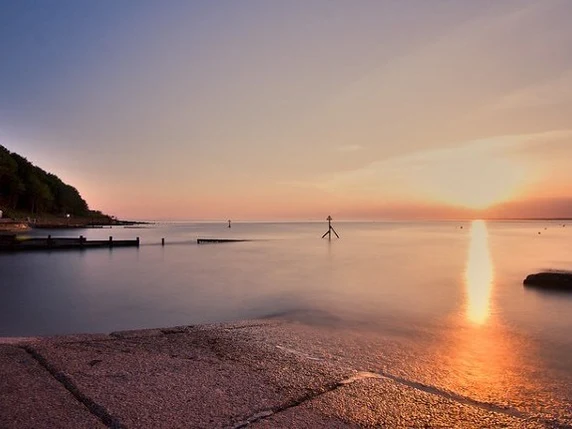 Sunset over Colwell Bay, a bay overview