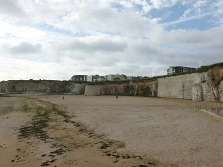 Sandy beach below the chalk cliffs at Palm Bay