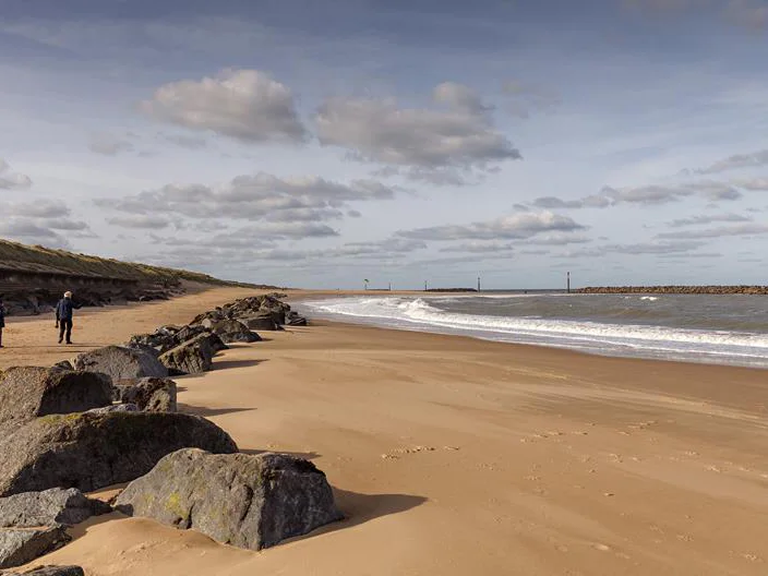 Rock groynes and sand at Sea Palling Beach