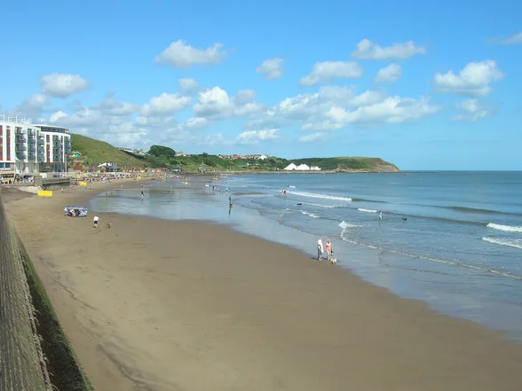 Wide sandy shore and headland at Scarborough North Bay