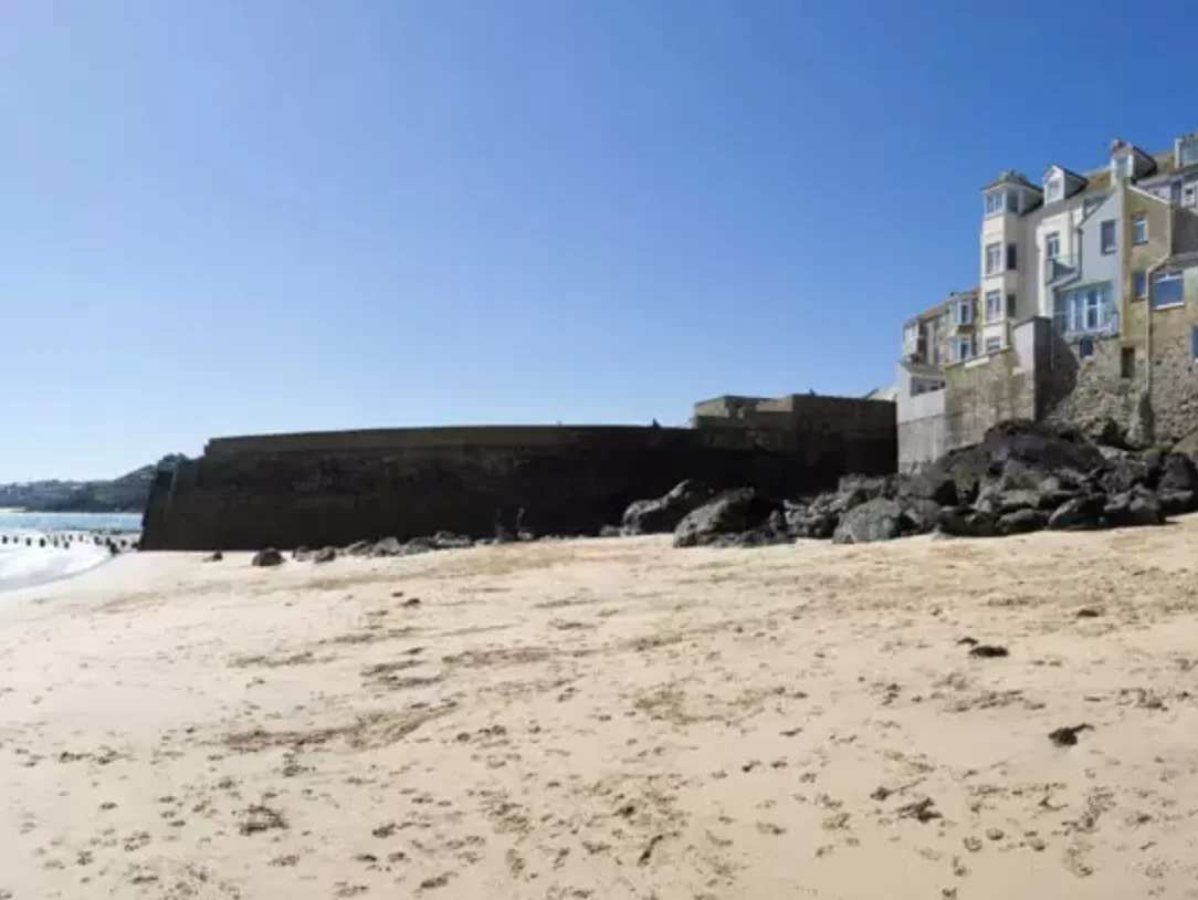 Bamaluz's sandy cove below Wheal Dream in St Ives.