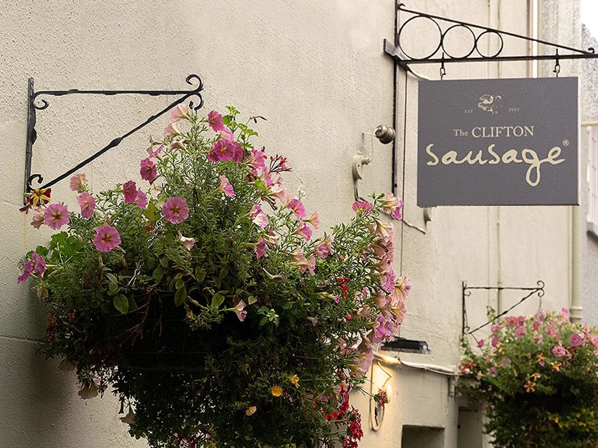 The Clifton Sausage sign and Portland Street frontage