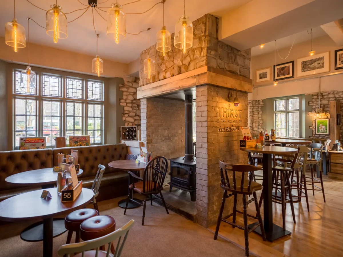 Tables and bar seating inside Brewhouse & Kitchen Cardiff