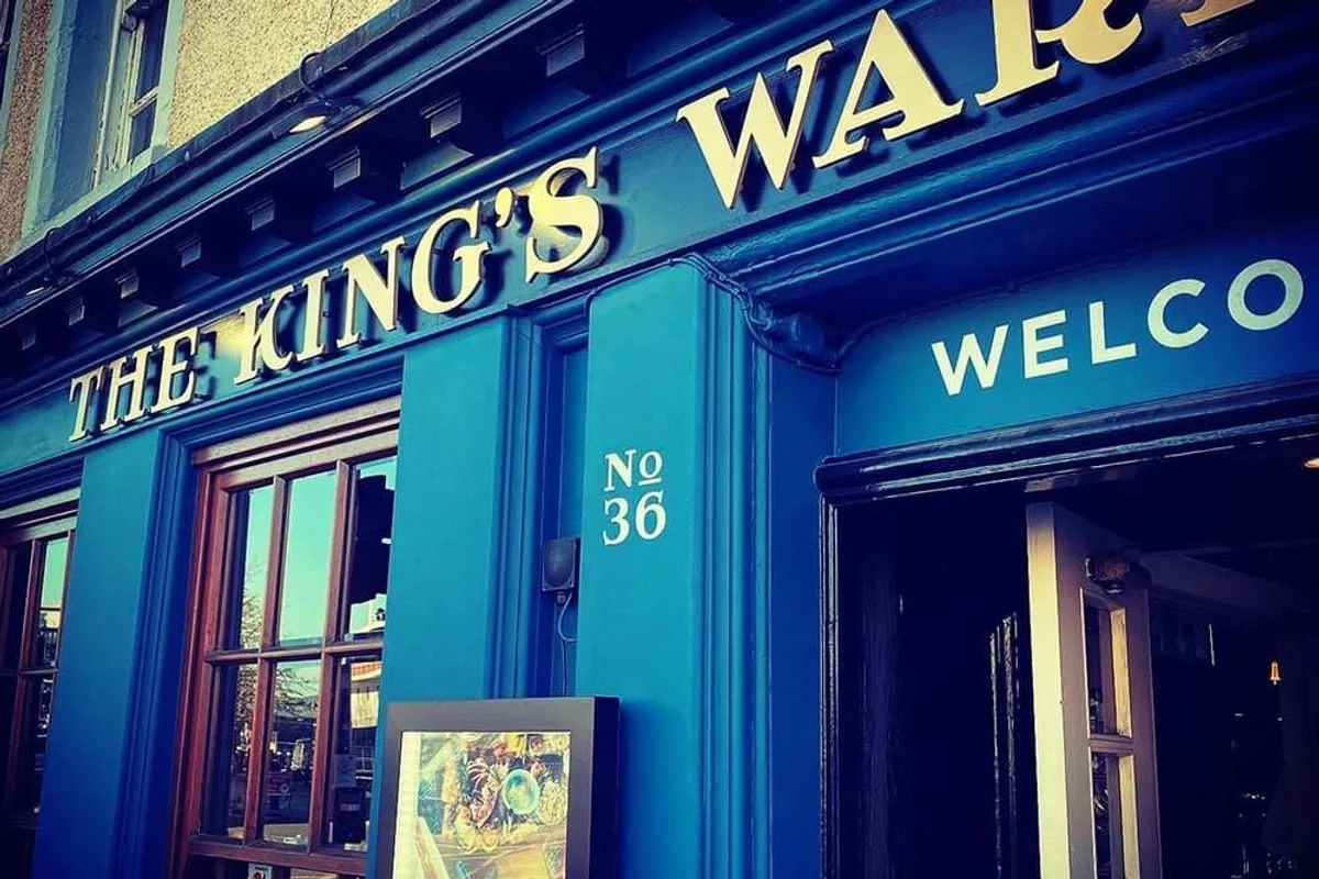 Blue frontage and doorway of The King's Wark, with number 36.