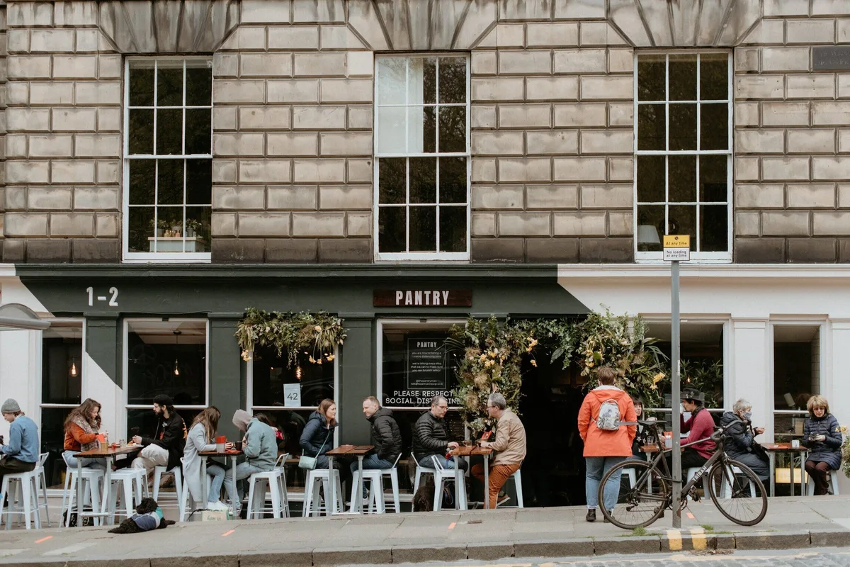 Customers at pavement tables outside The Pantry in Stockbridge.