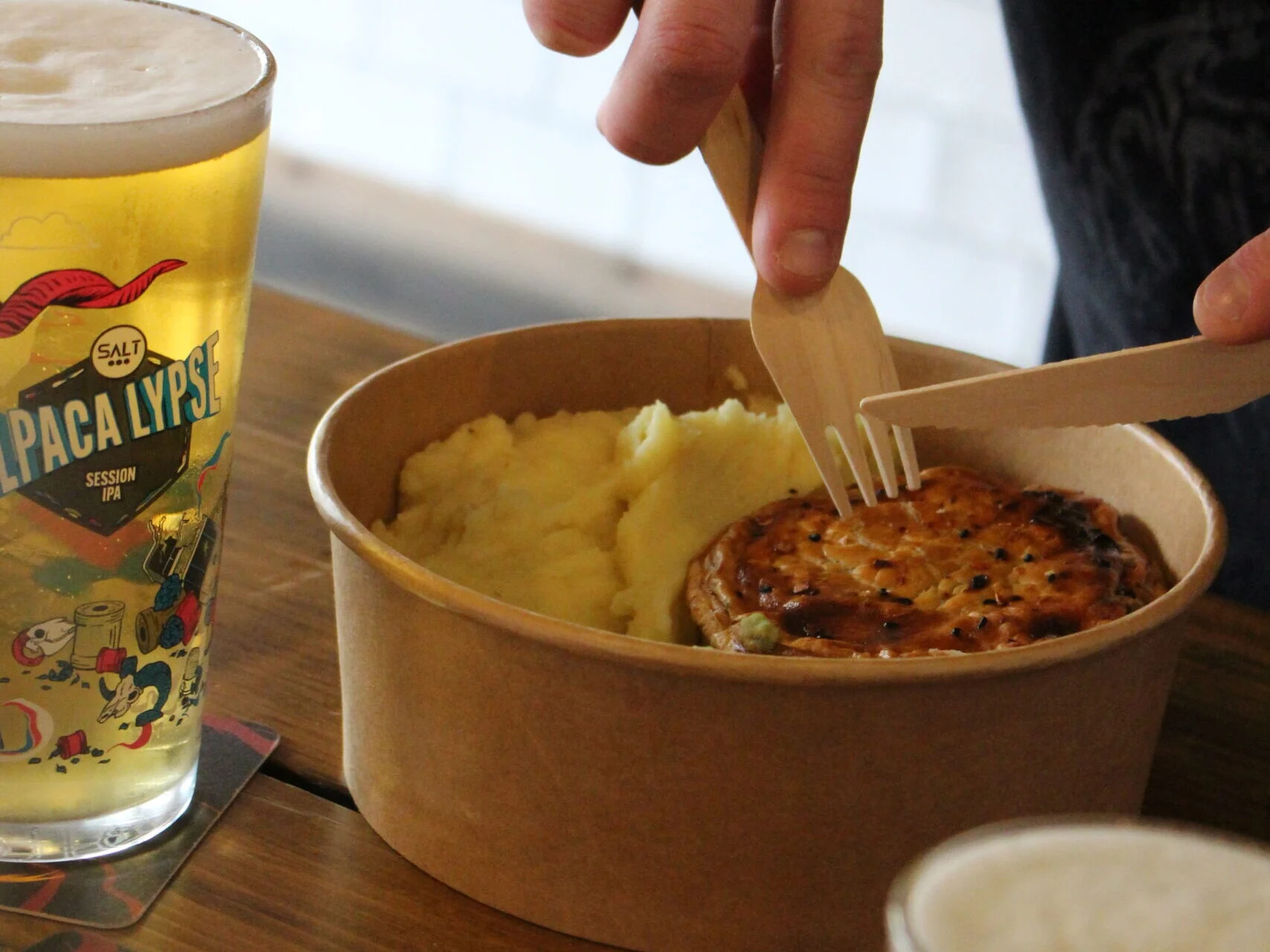 A pie with mash and a drink at The Clock Inn Oakwood.