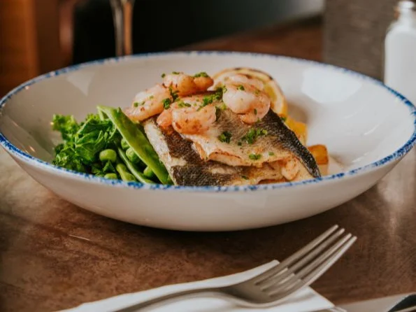 A plated fish dish from The Mustard Pot.
