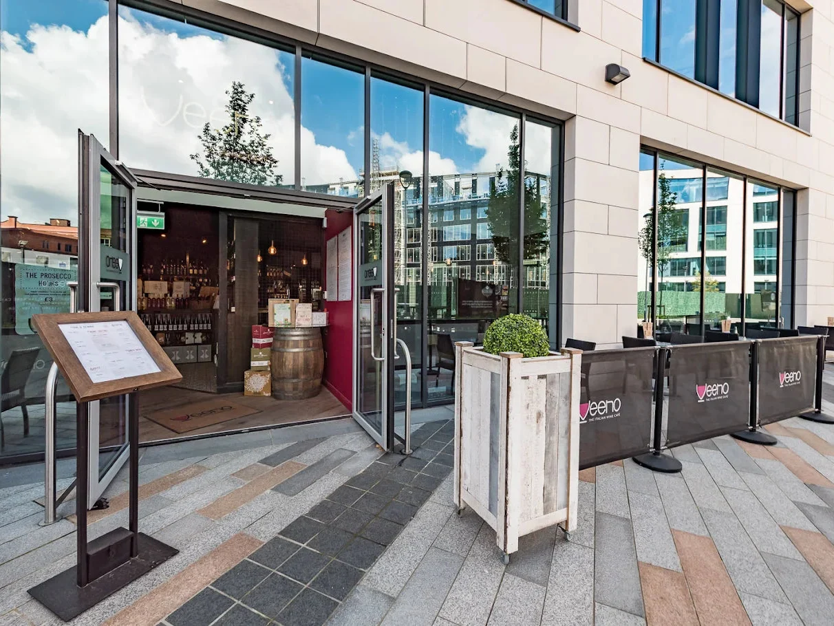 Veeno Leeds entrance and outdoor tables on Wellington Place.
