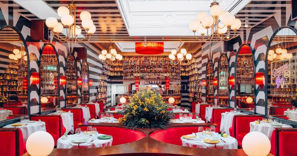 Ave Mario dining room with red booths and globe lights