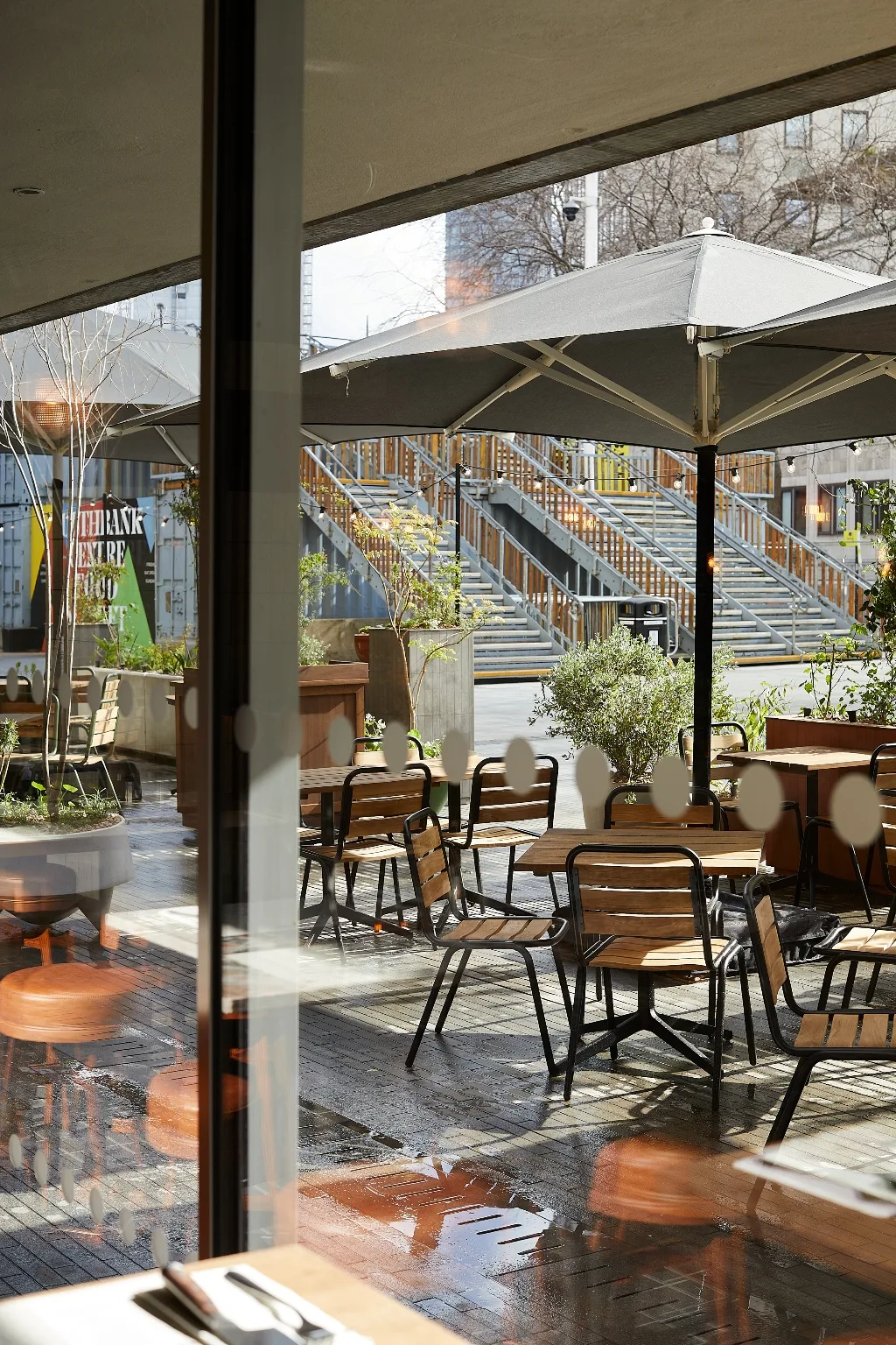 Outdoor tables and umbrellas at Flat Iron Southbank