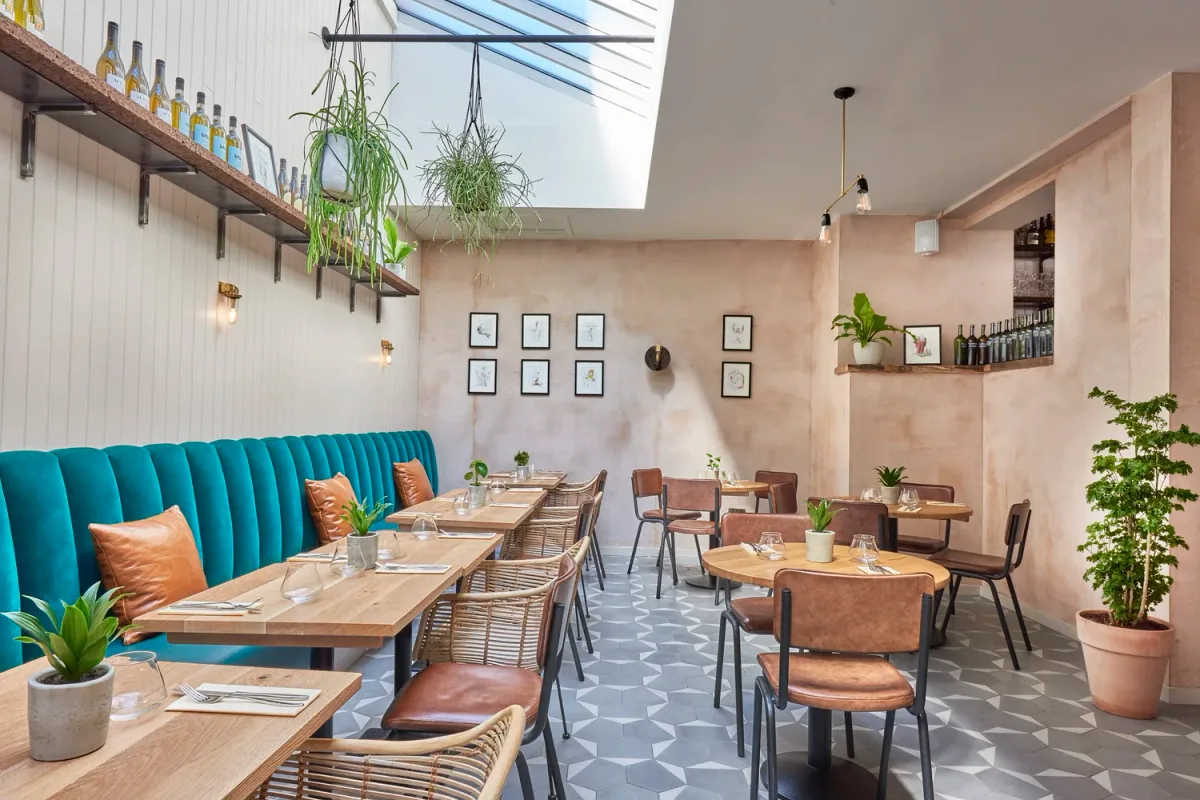 Tables and wine displays inside Humble Grape Islington