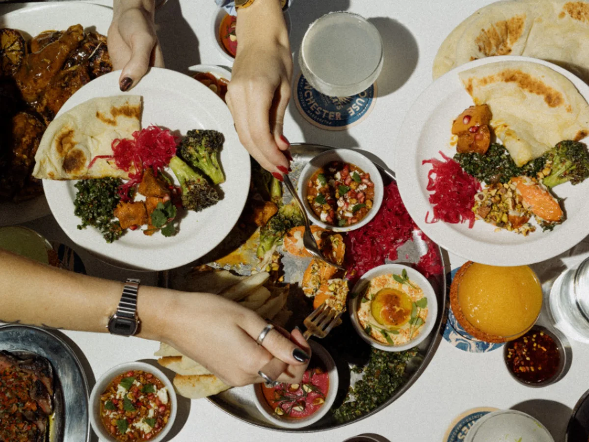 Plates of food being shared at The Firehouse Manchester