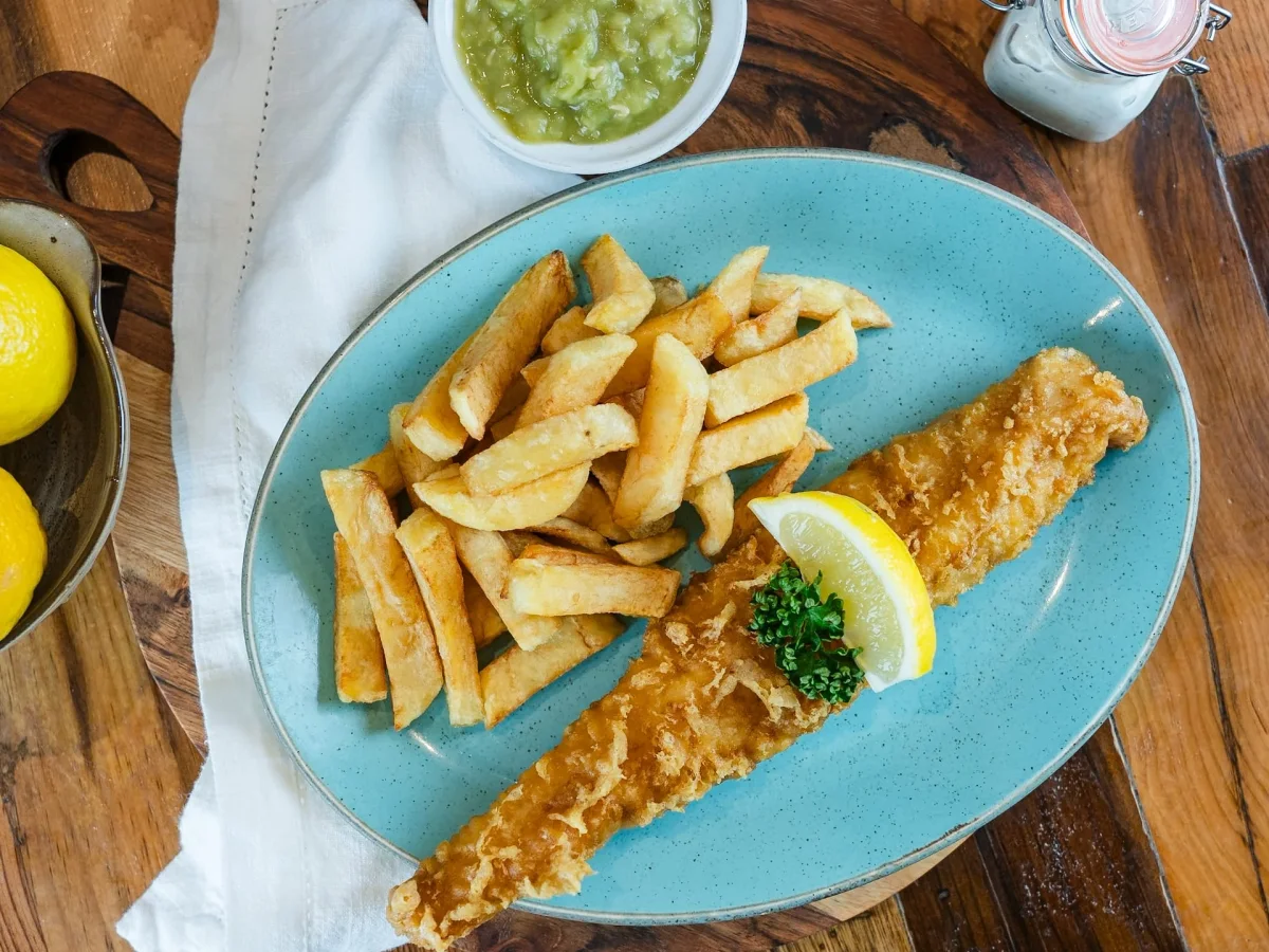 Fish and chips on a blue plate at Hadley’s