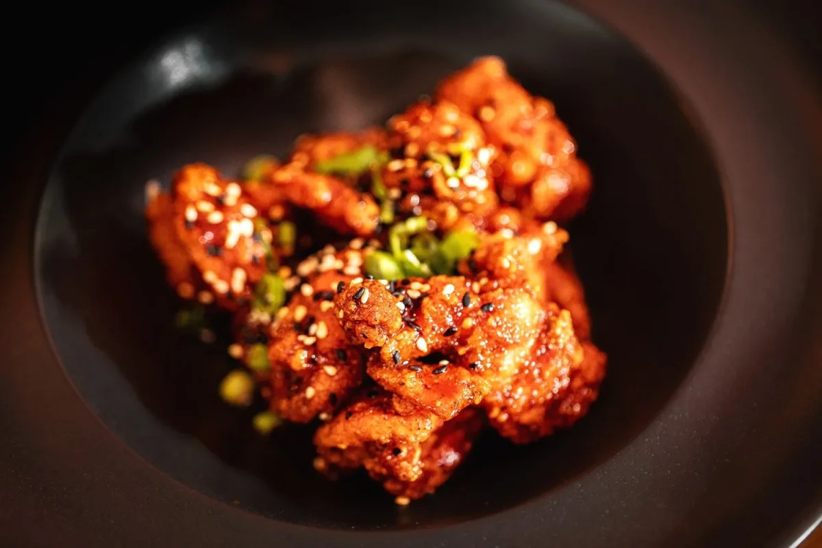 Glazed food in a dark bowl from Kennedy’s